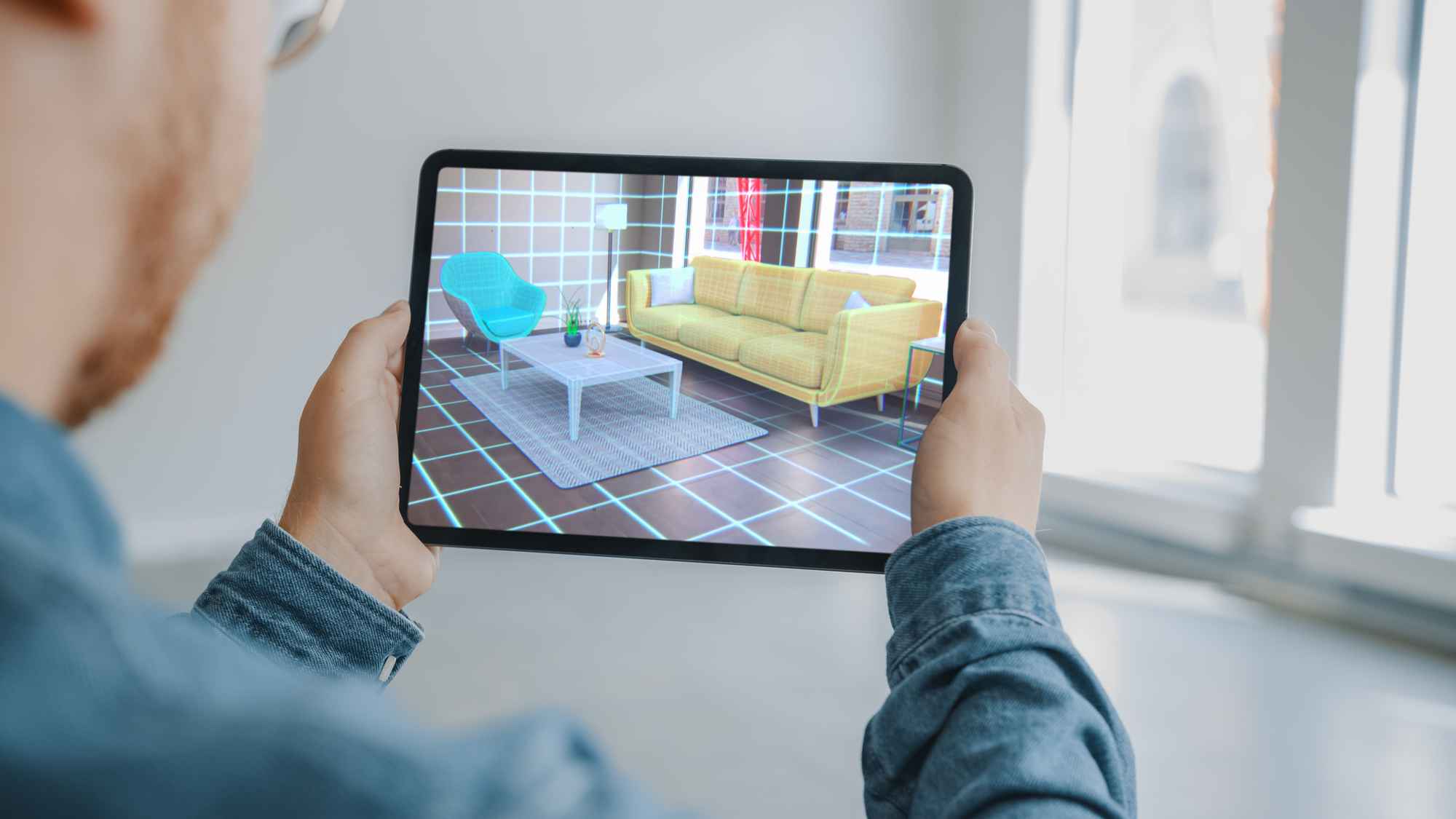 Man Looking Browsing Through A Design On A Tablet